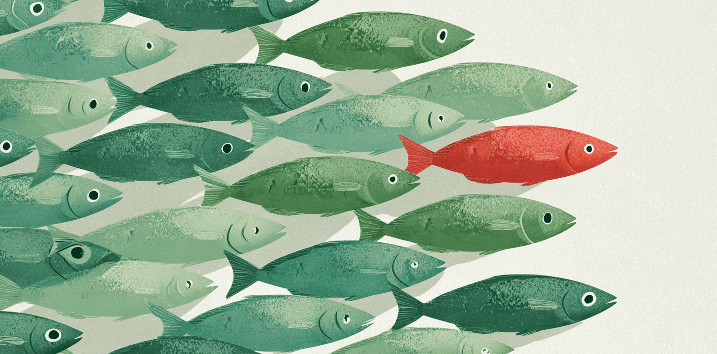 Illustration of a dense school of green fish swimming one way while a single red fish swims against them