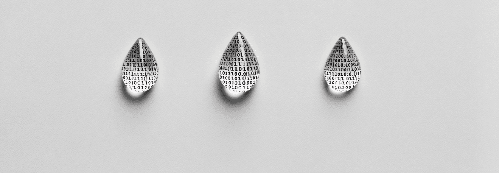 Three glass water droplets filled with binary code against a plain grey background